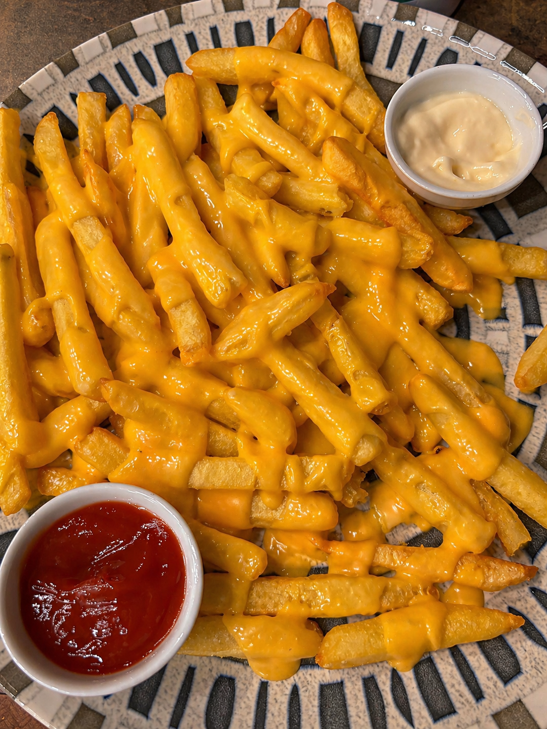 Papas fritas con cheddar